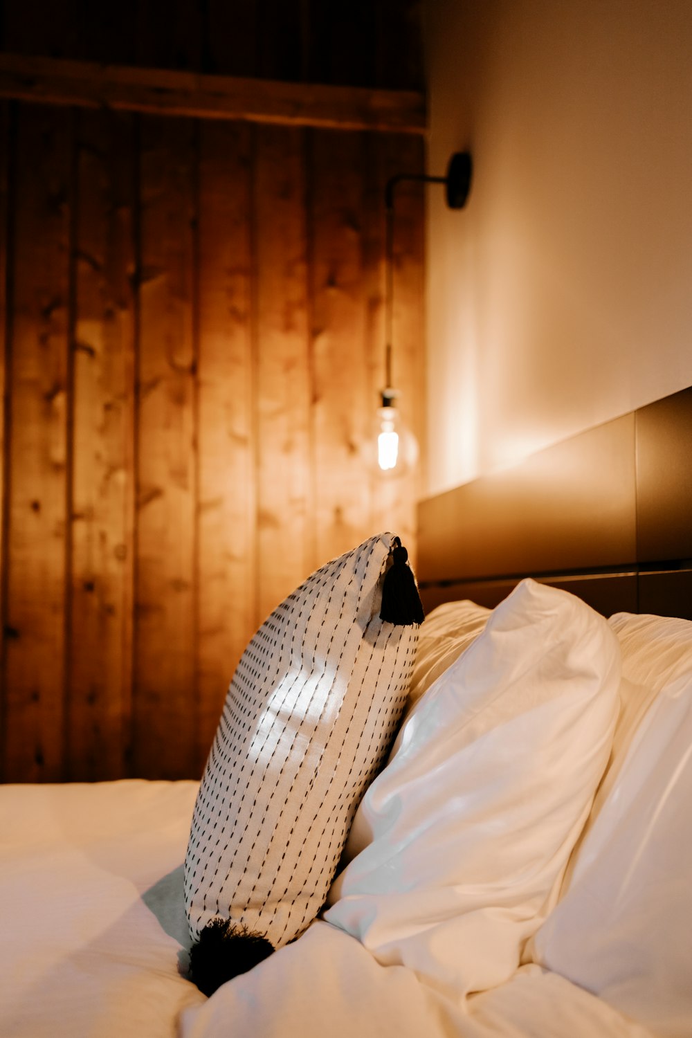 white textile on white bed