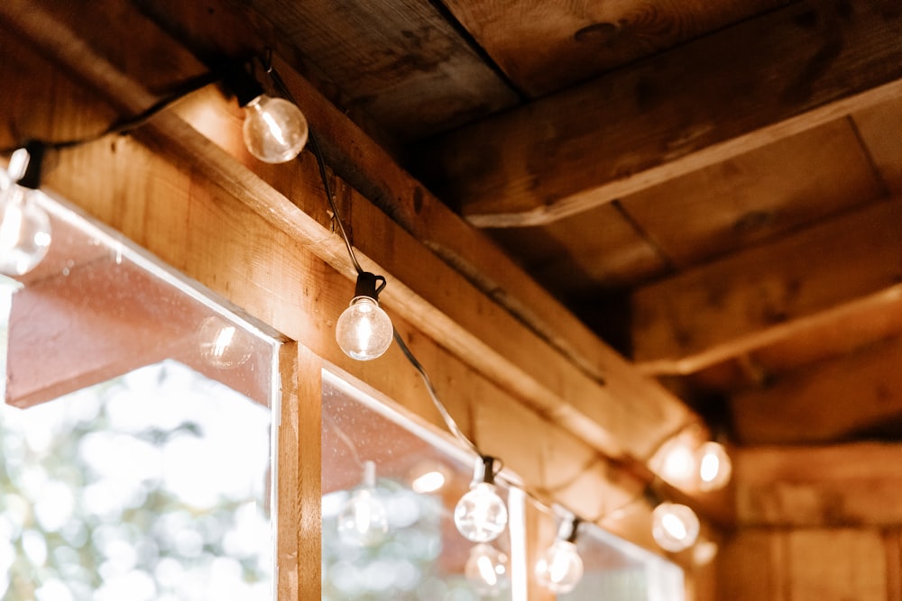 white pendant lamp turned on during daytime