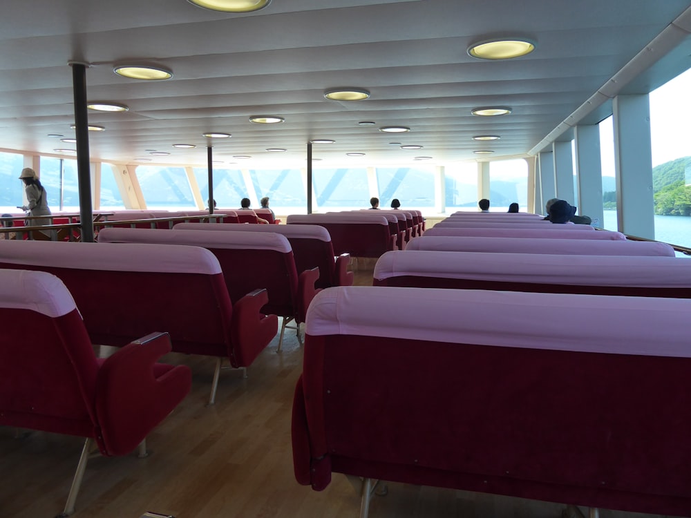 a room filled with lots of tables covered in purple cloths