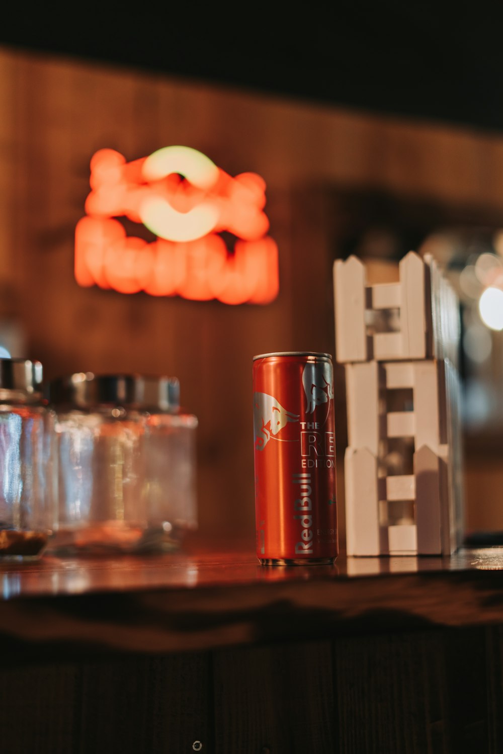 a can of soda sitting on top of a wooden table