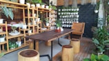 Bright, cozy common area with wooden furniture and plants at Solid Pine.