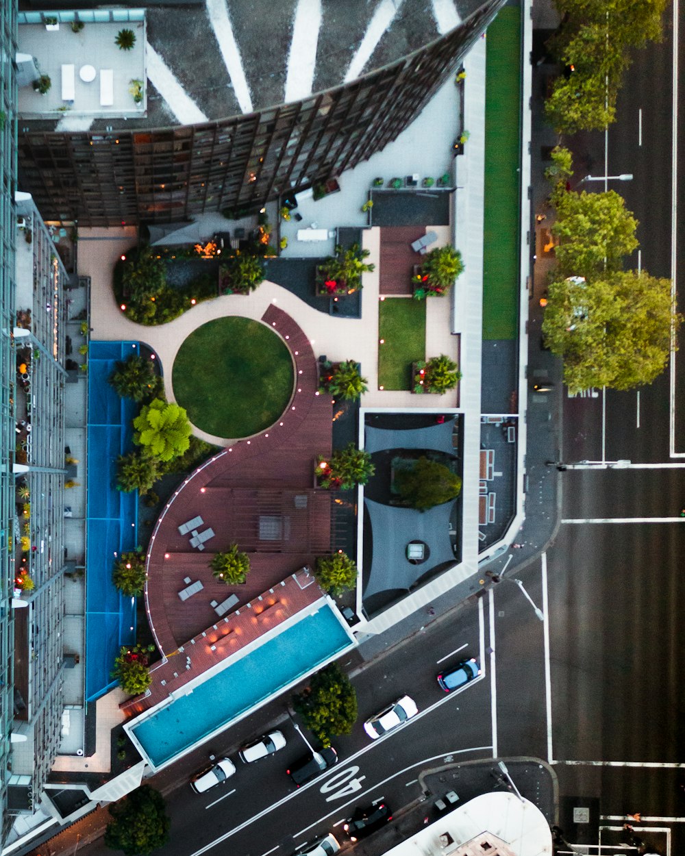 an aerial view of a city street and a parking lot