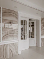white wooden framed glass door