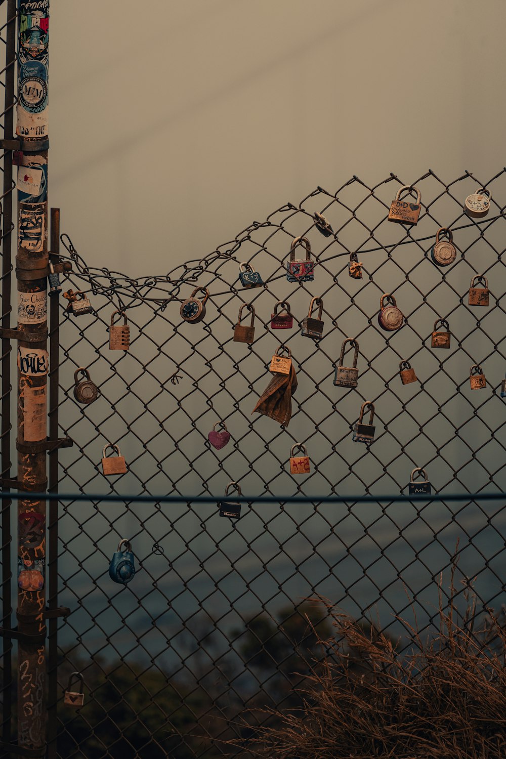 gray metal fence with padlock