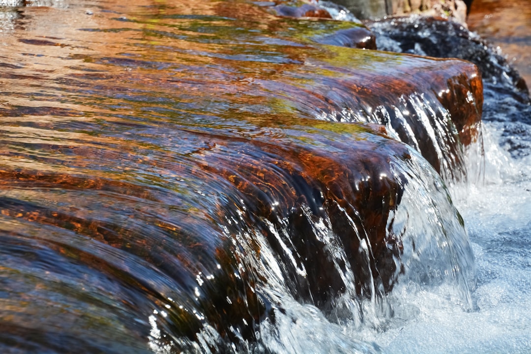 water falls in the middle of the woods