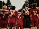 boys in red jersey shirts