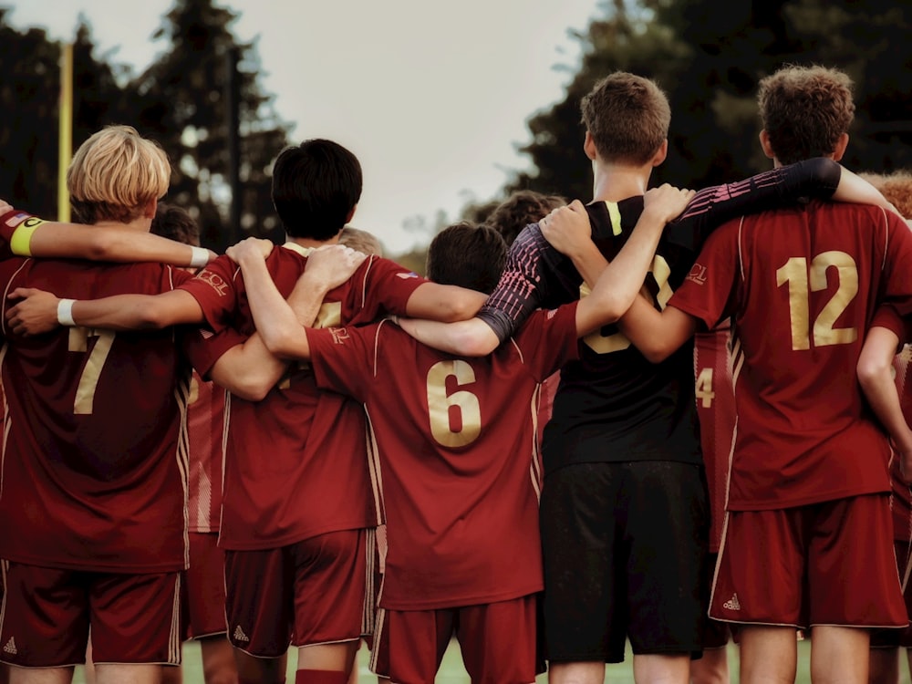 boys in red jersey shirts