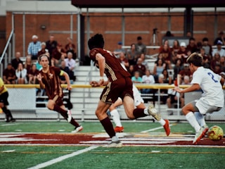 Football players in vibrant, breathable uniforms during a match.