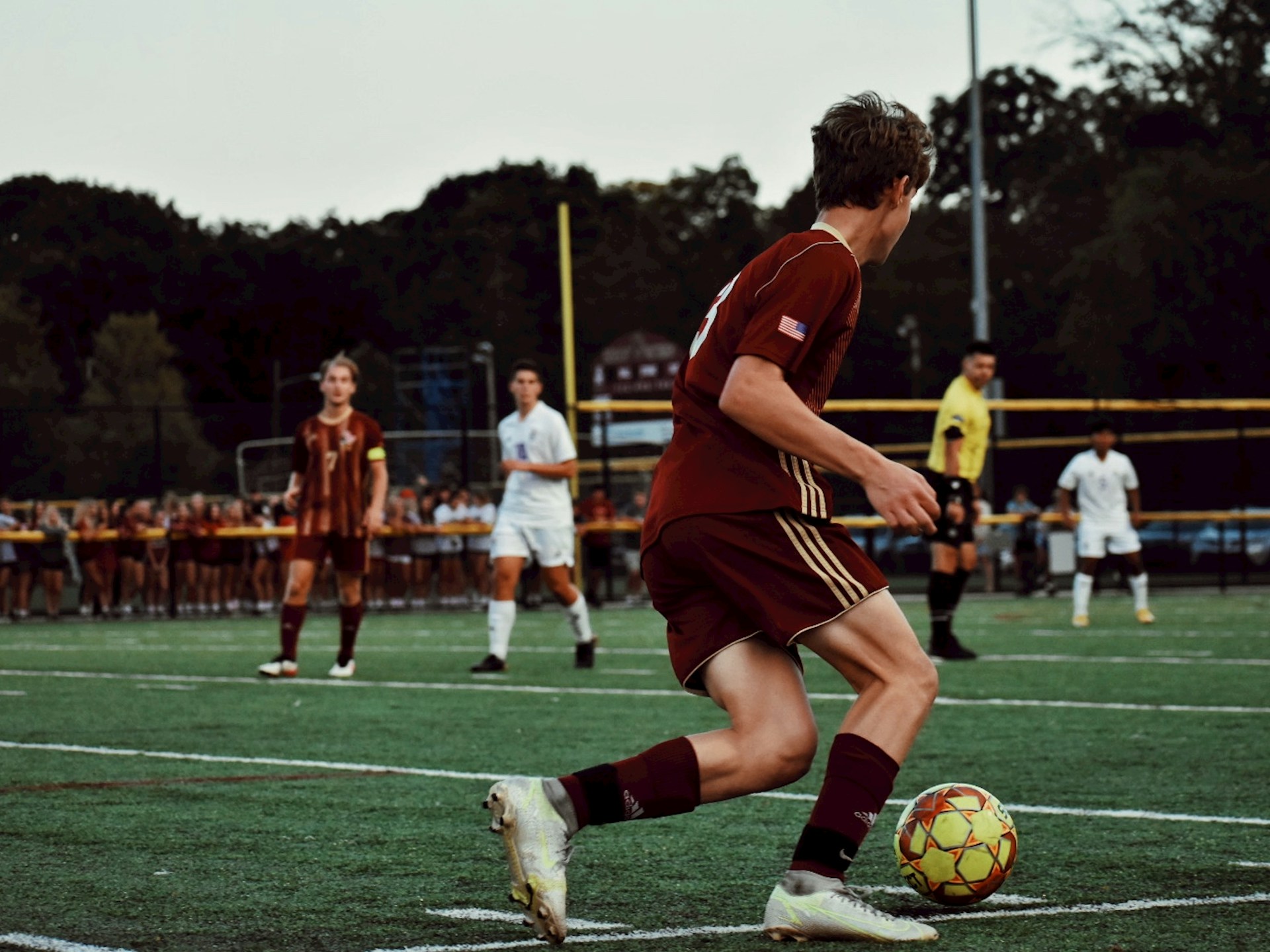 soccer players on field during daytime