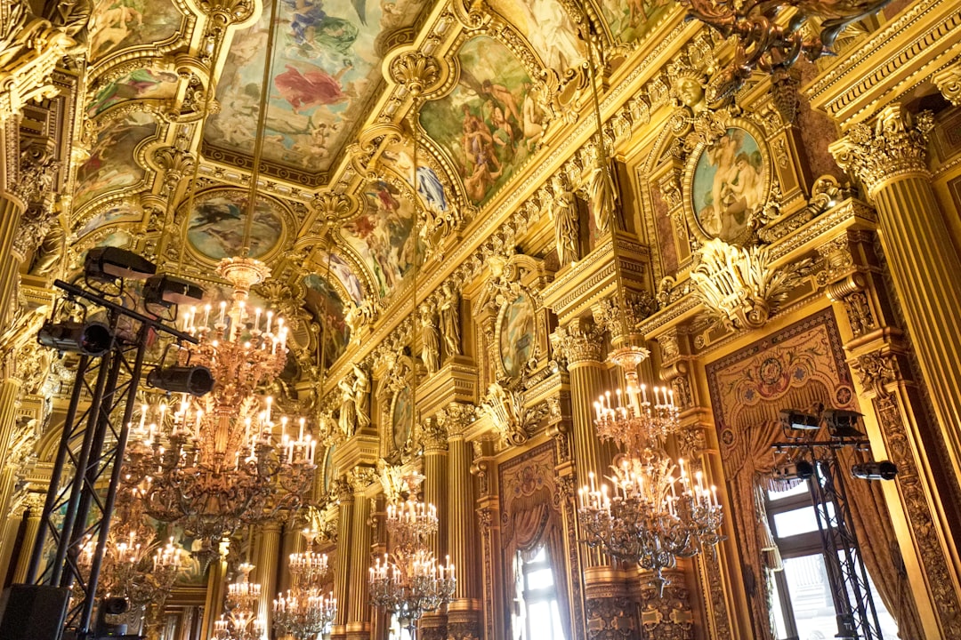 gold and white uplight chandelier