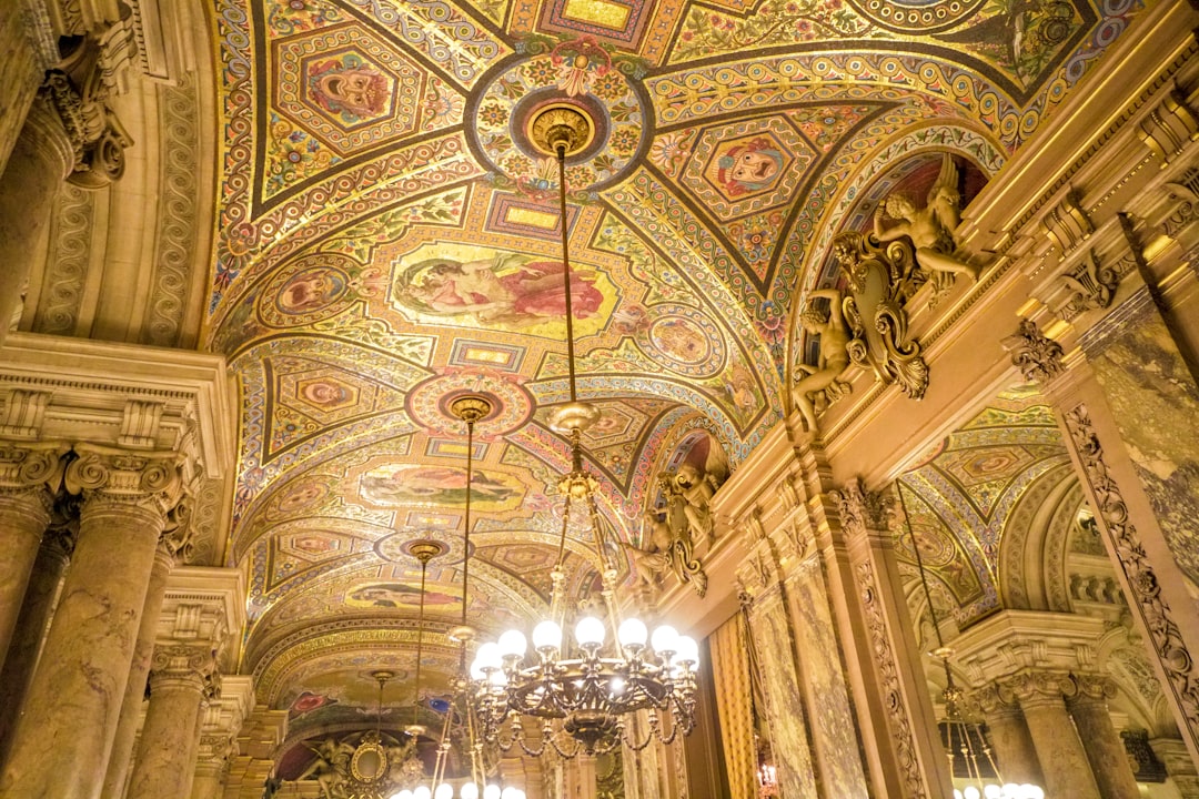 gold and white ceiling with chandeliers