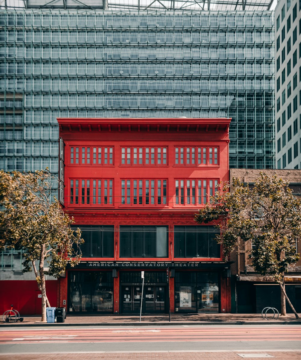 red wooden framed glass window building