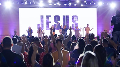 a group of people standing on top of a stage