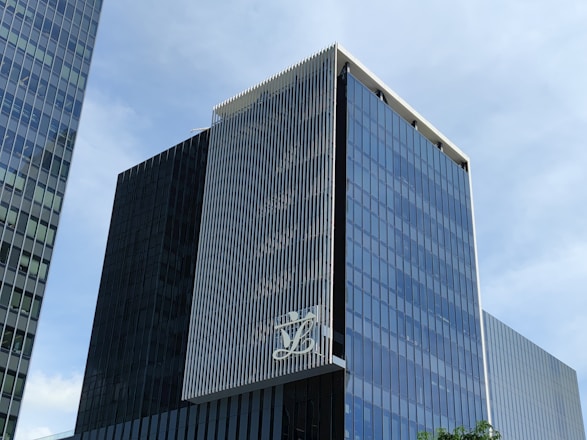 Modern corporate building with blue and white branding representing GKE Holding's global presence.