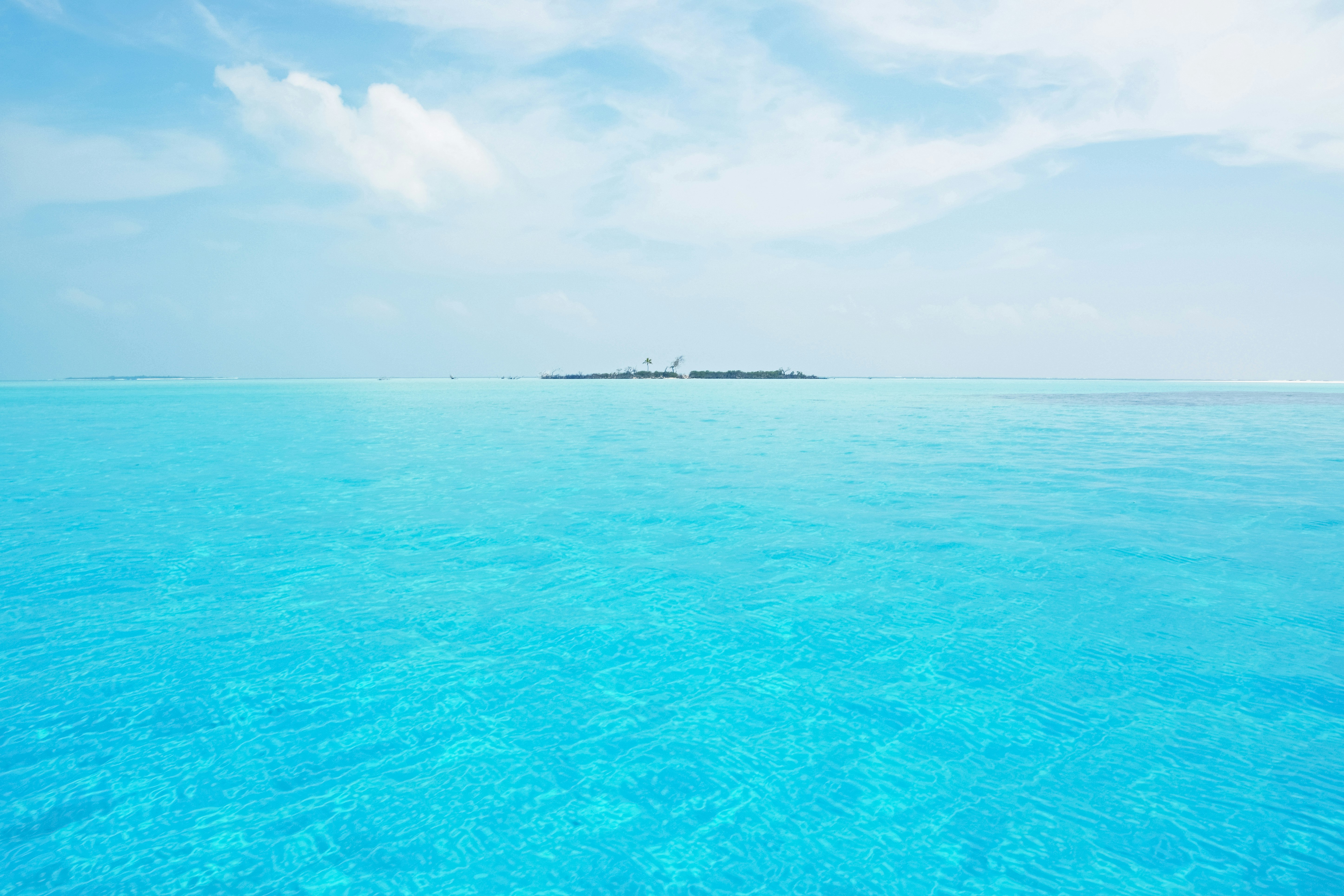 blue sea under blue sky during daytime