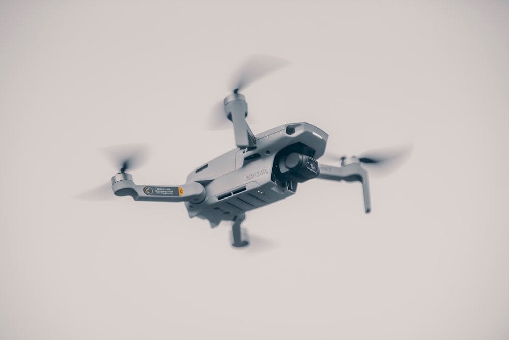 white and black drone in close up photography