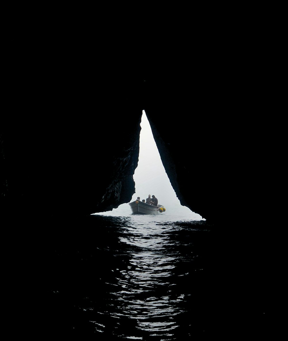 a group of people on a boat in the water