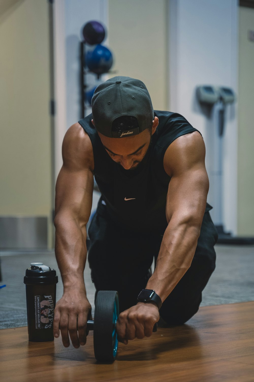 a man doing push ups on a gym floor