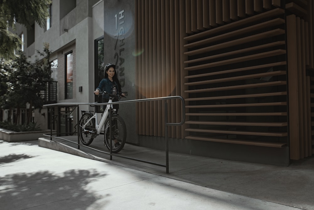 woman in black jacket riding bicycle