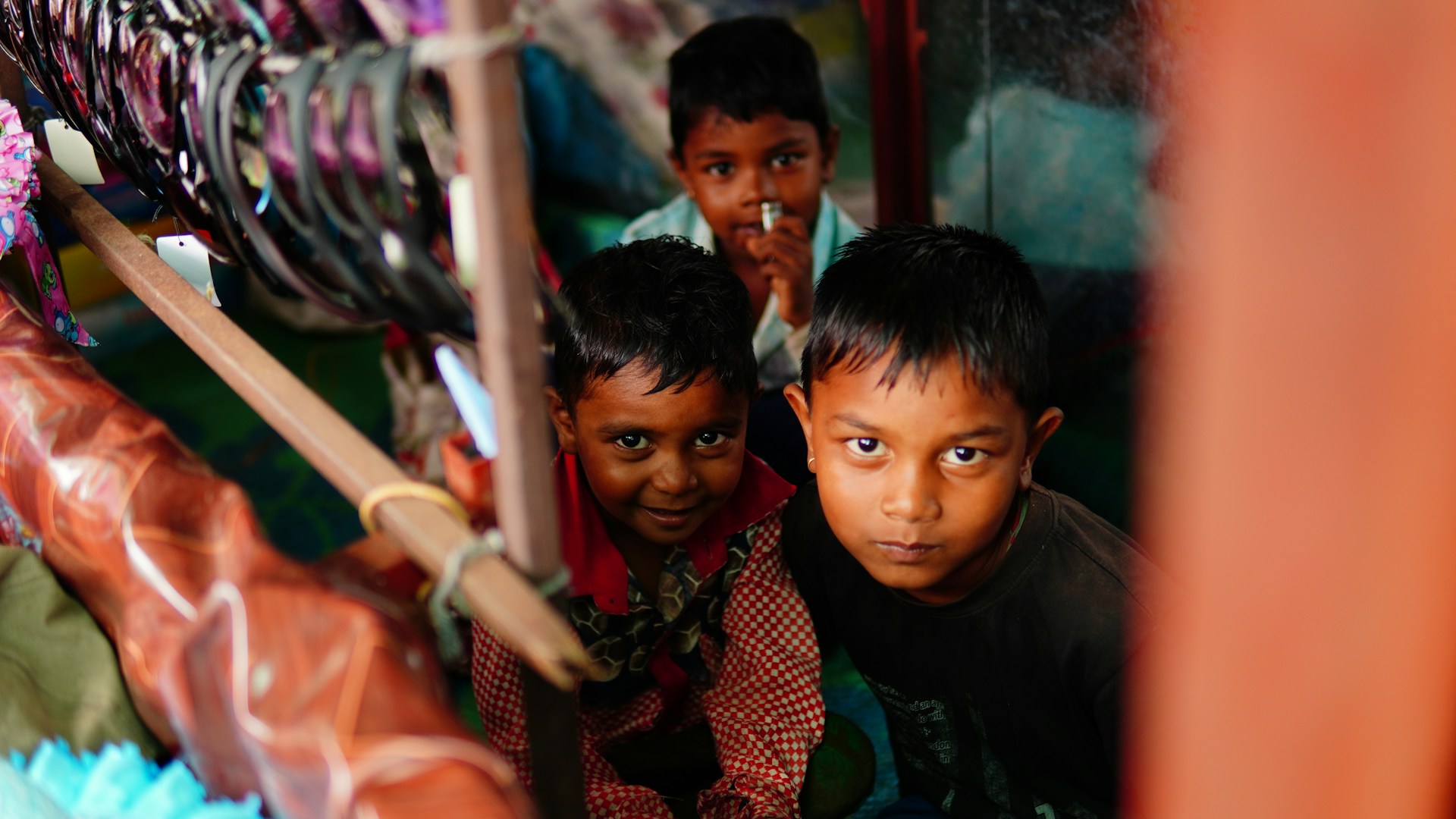 a group of young boys standing next to each other