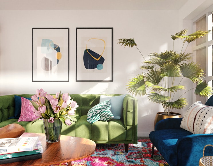 Colorful living room with modern art and a large houseplant.