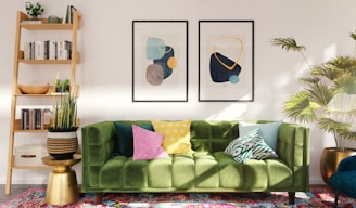 green and white throw pillows on green sofa