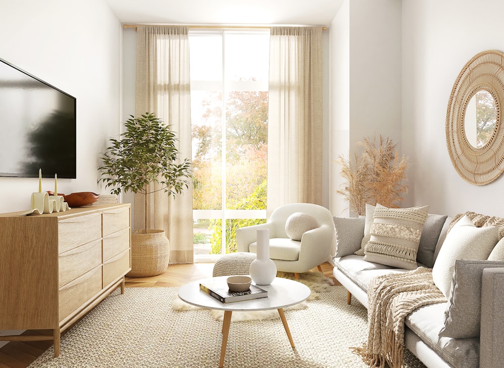 white and gray sofa chair near window