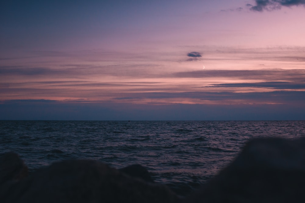 a view of a body of water at sunset