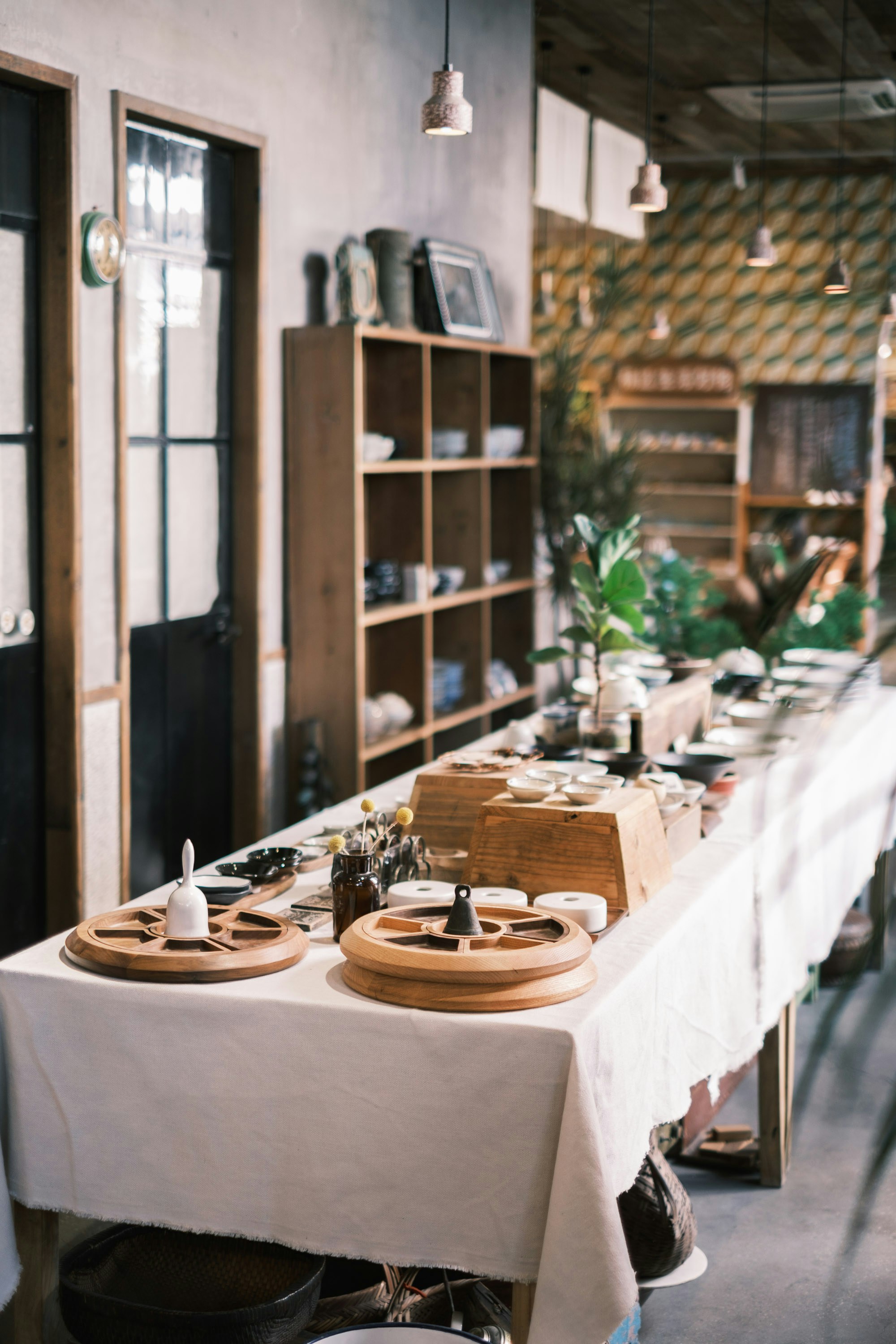 brown wooden table with plates and bowls on top