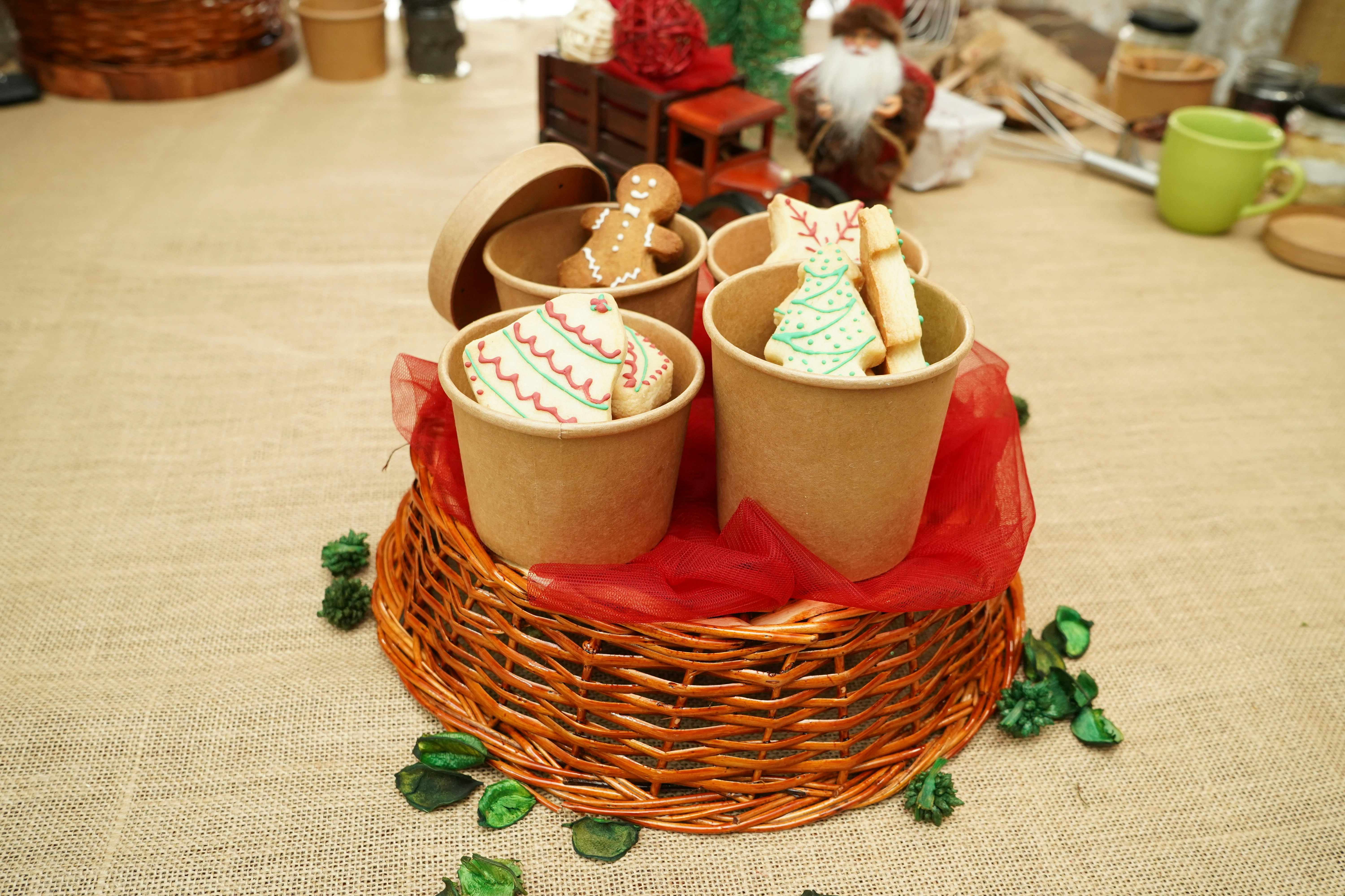 Festive cookies and specialty teas displayed in holiday gift basket