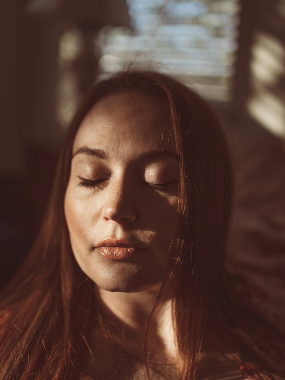 woman in red shirt looking up