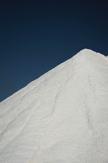 white sand under blue sky during daytime