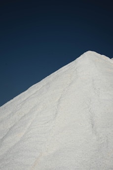 white sand under blue sky during daytime