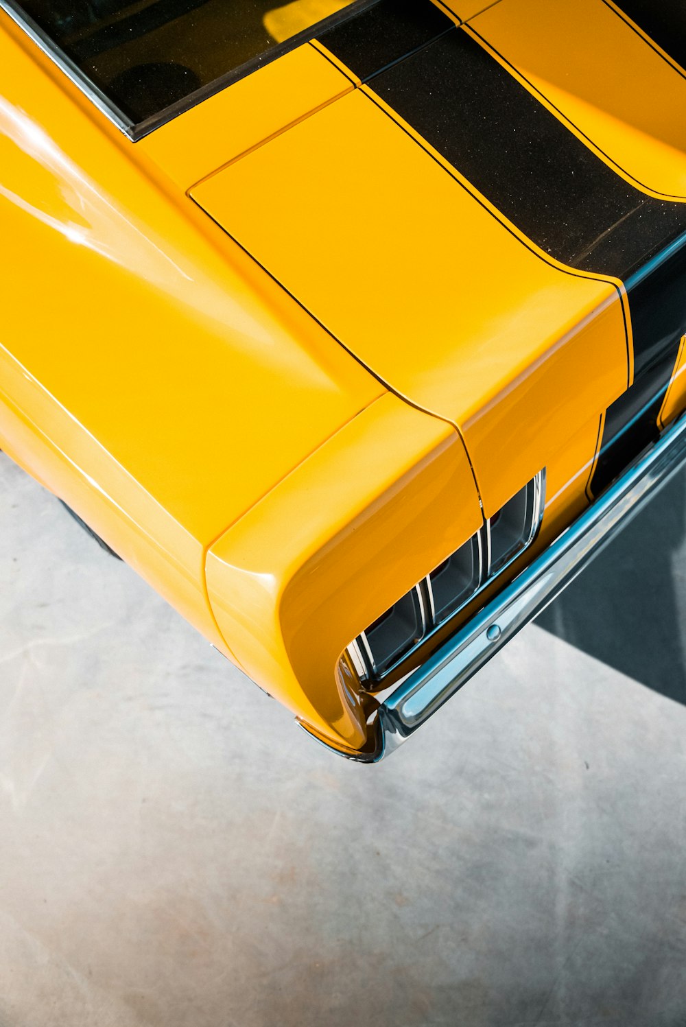 yellow car on gray floor