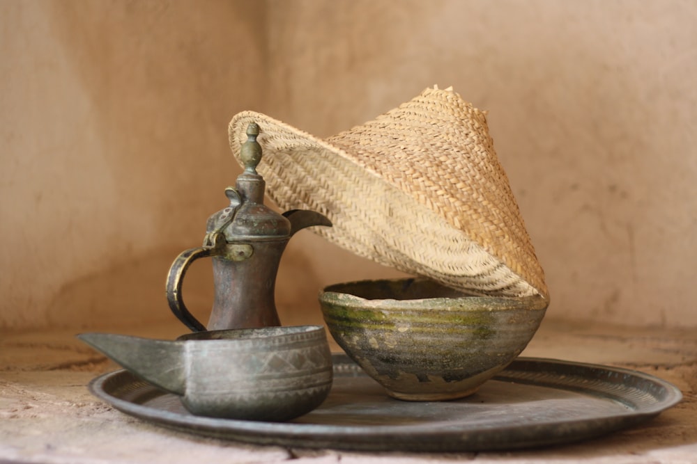 a straw hat sitting on top of a bowl