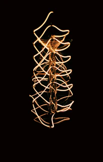 a long exposure photo of a string of lights