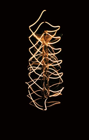 a long exposure photo of a string of lights