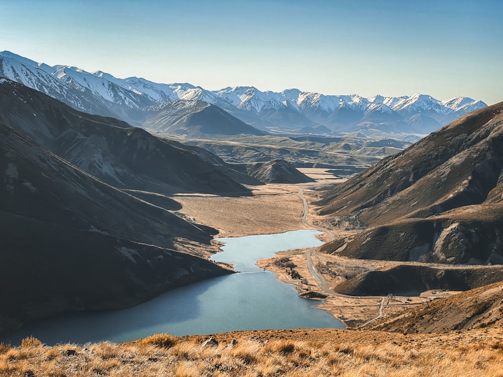 a view of a mountain range with a lake in the middle