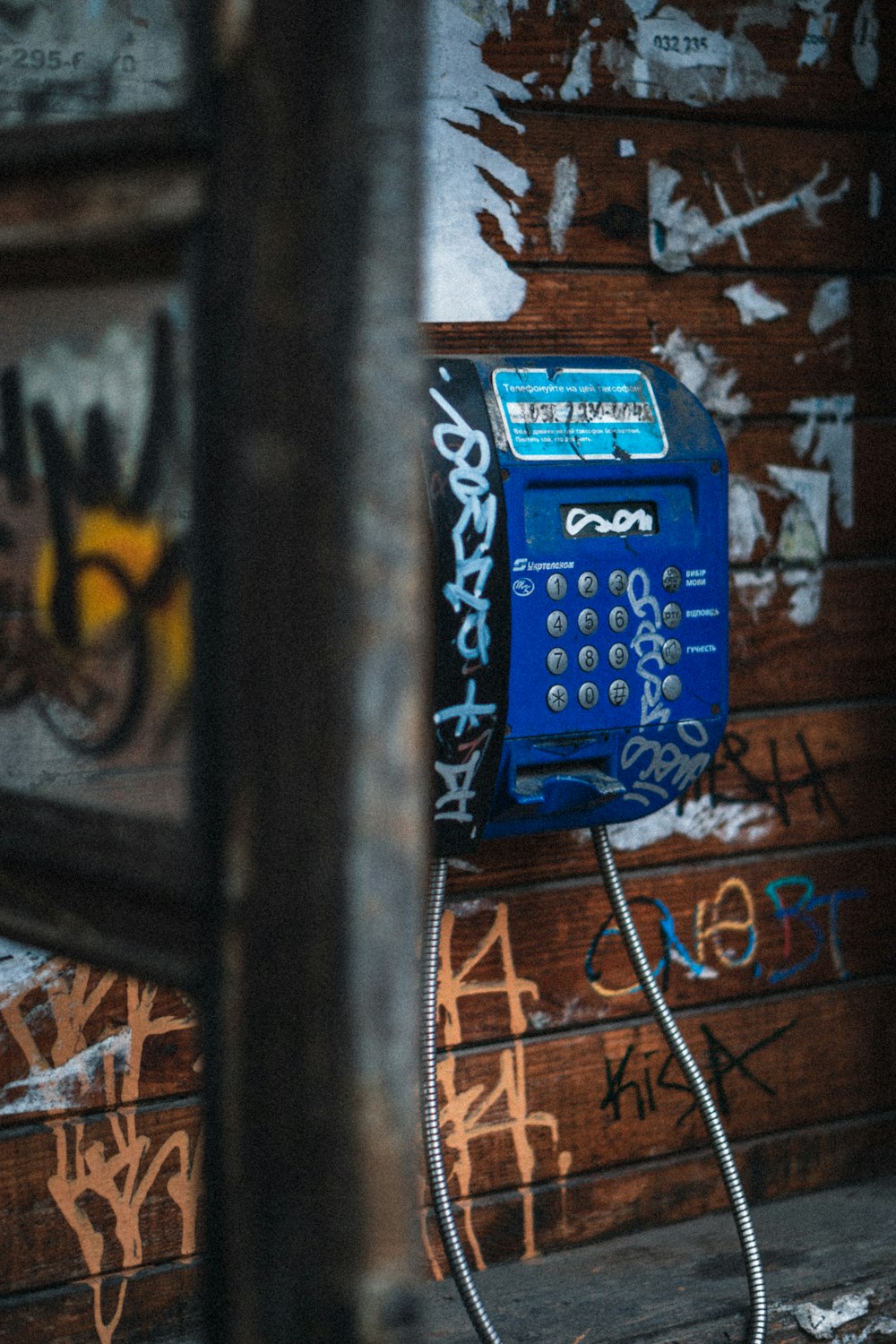 blue and yellow telephone booth