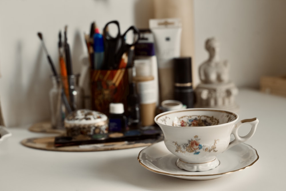 a cup and saucer sitting on top of a table