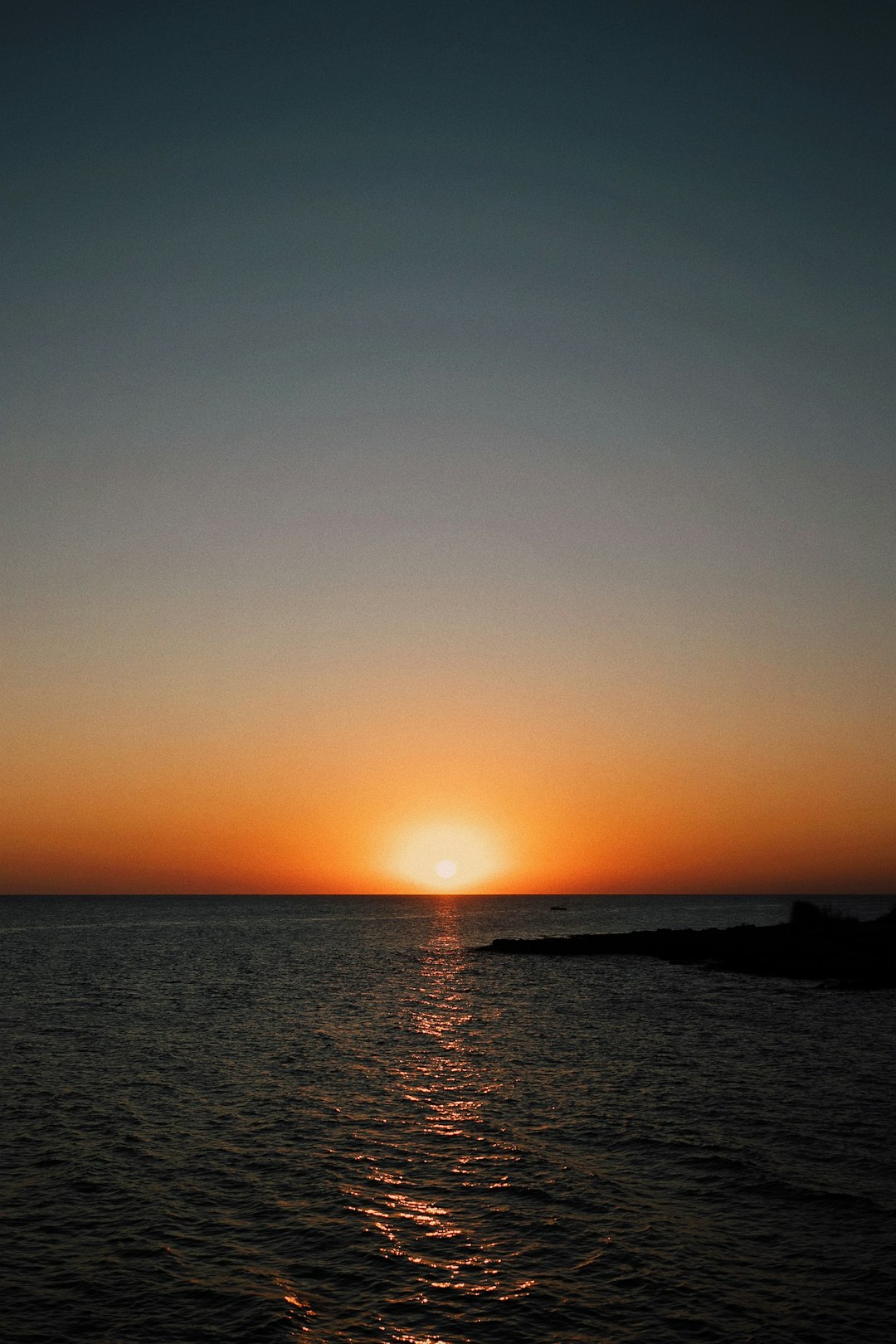 body of water during sunset