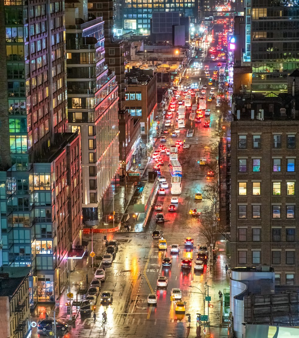 a city street filled with lots of traffic at night