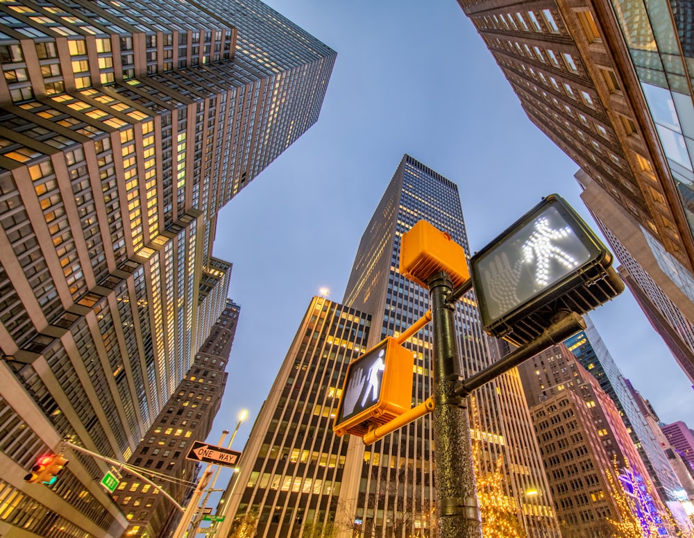 a city street with tall buildings and traffic lights