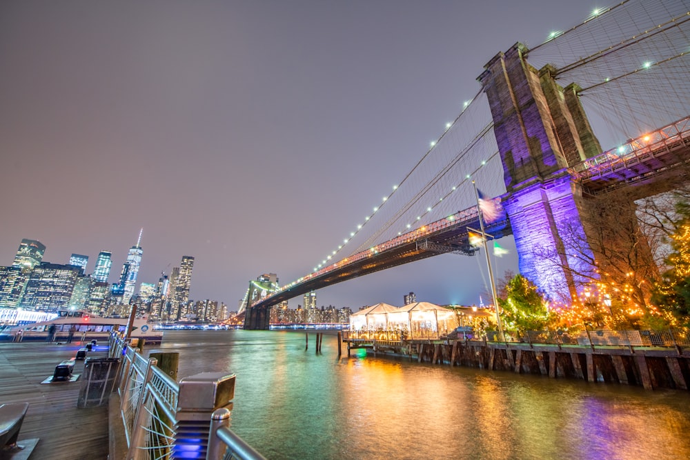 a view of the brooklyn bridge at night