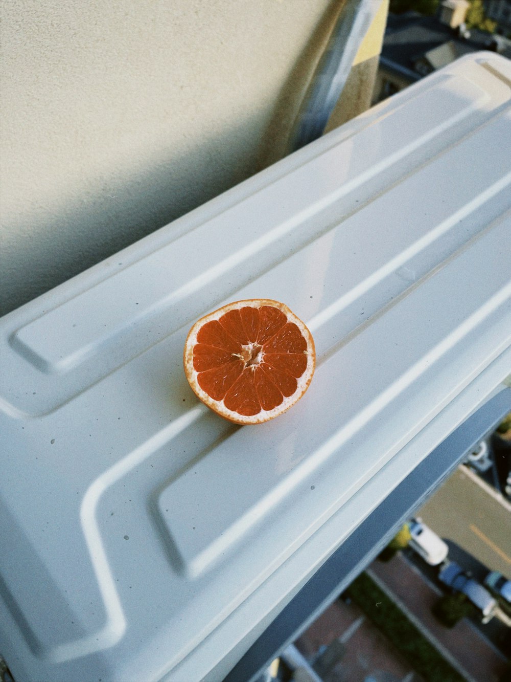 orange fruit on white plastic container