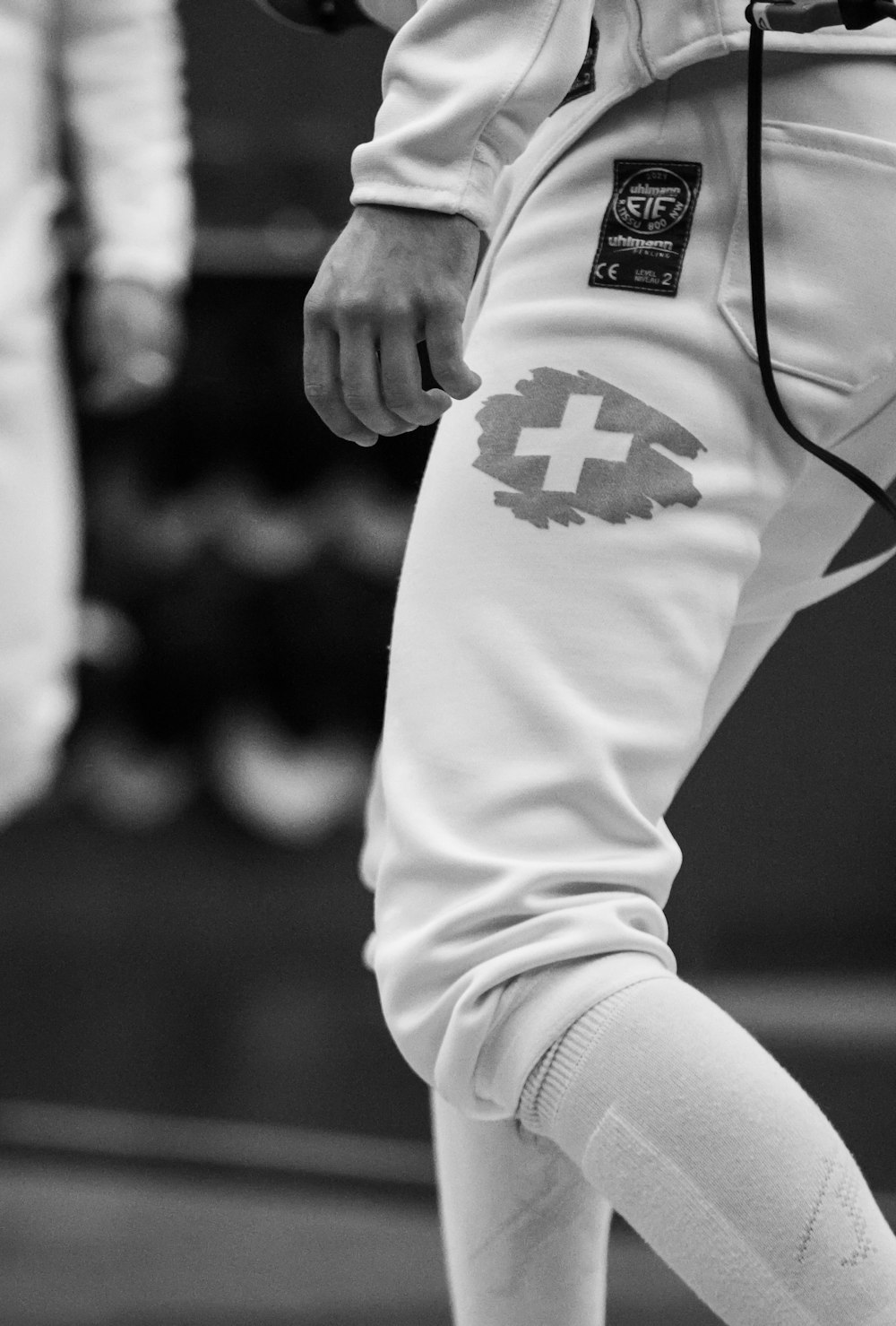 a close up of a person holding a tennis racquet