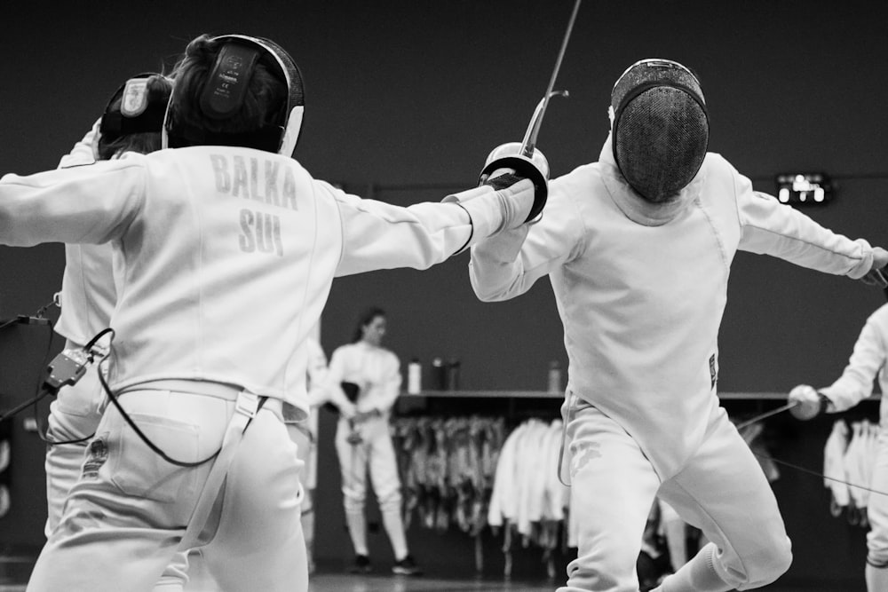 a couple of men standing next to each other on a court