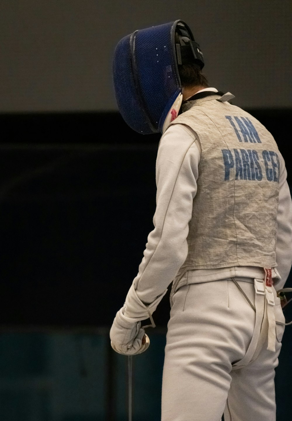 a man wearing a helmet and white pants