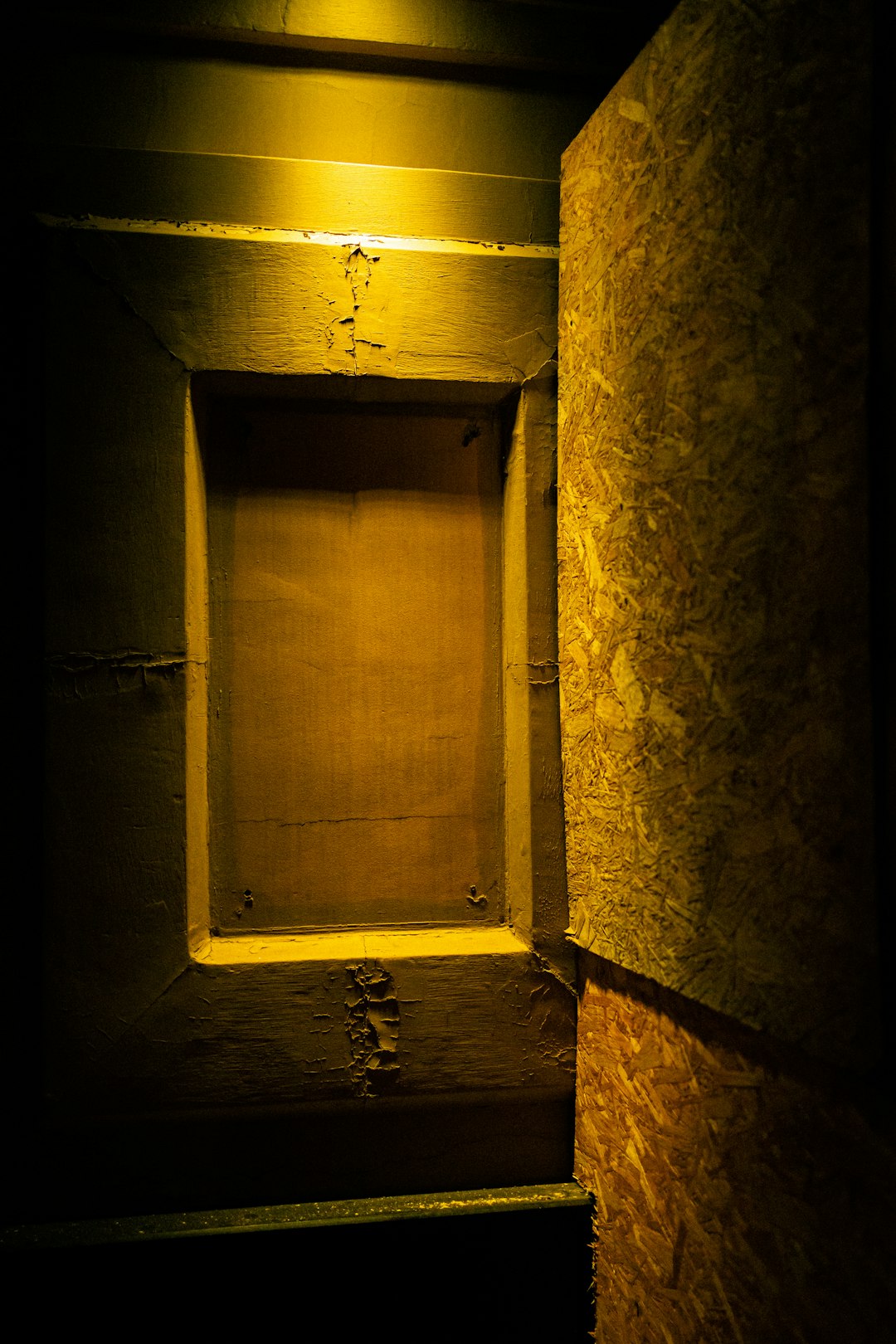 brown wooden door with white floral wall