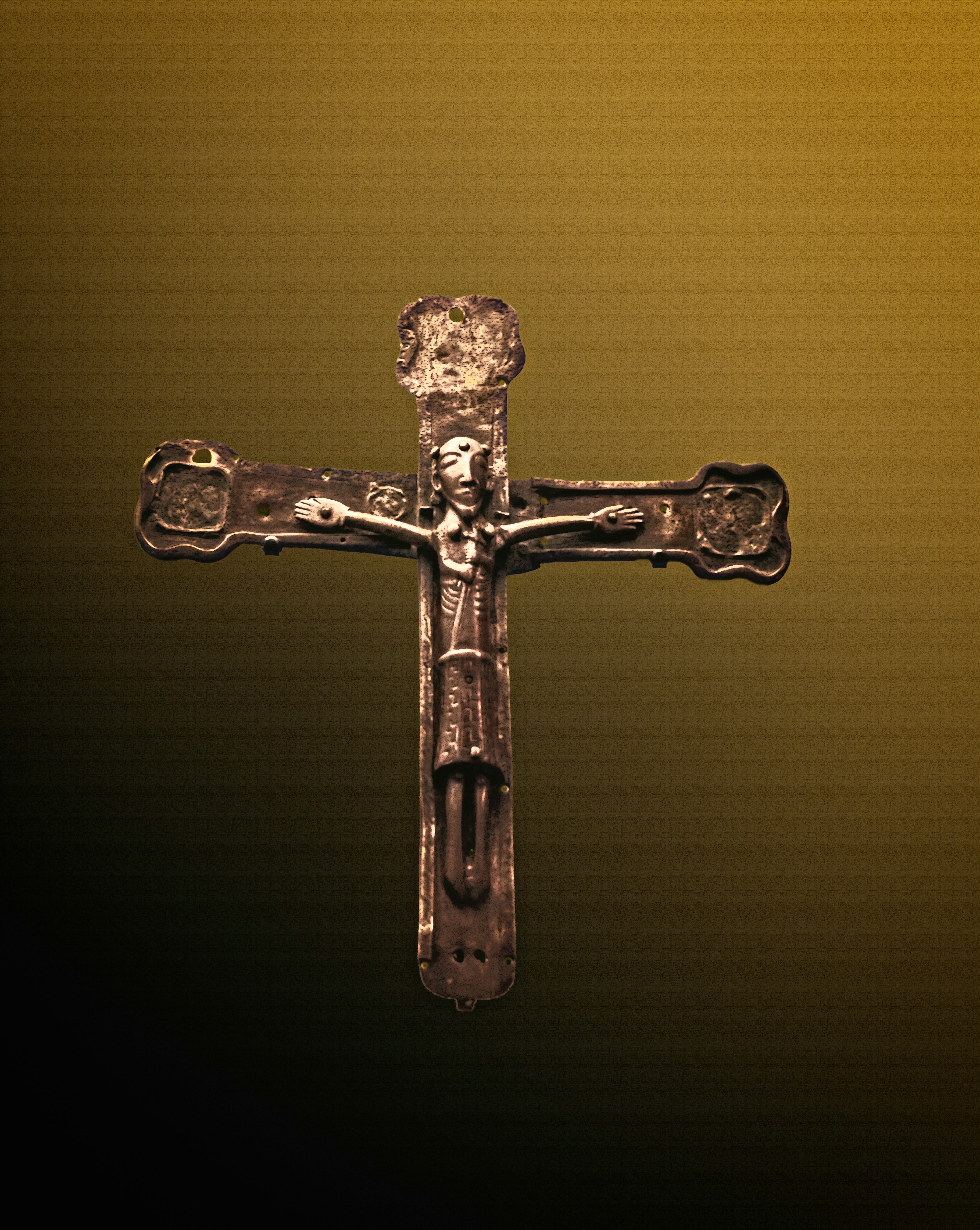 gold cross with yellow background